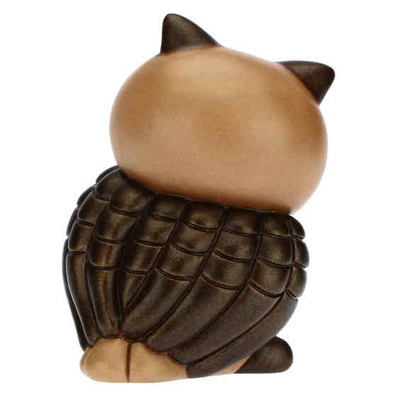 Wise owl with lucky four-leaf clover