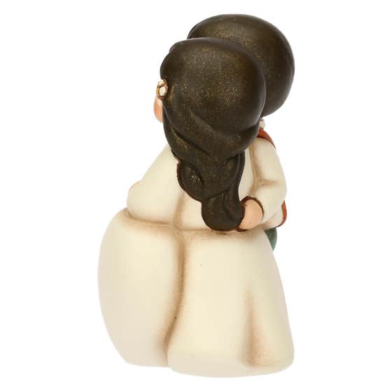 Small ceramic newlyweds with hearts