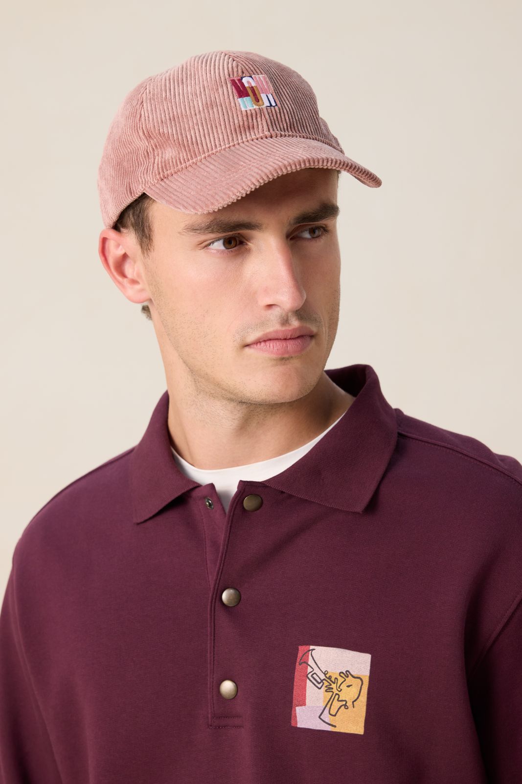 Roze corduroy pet met artwork