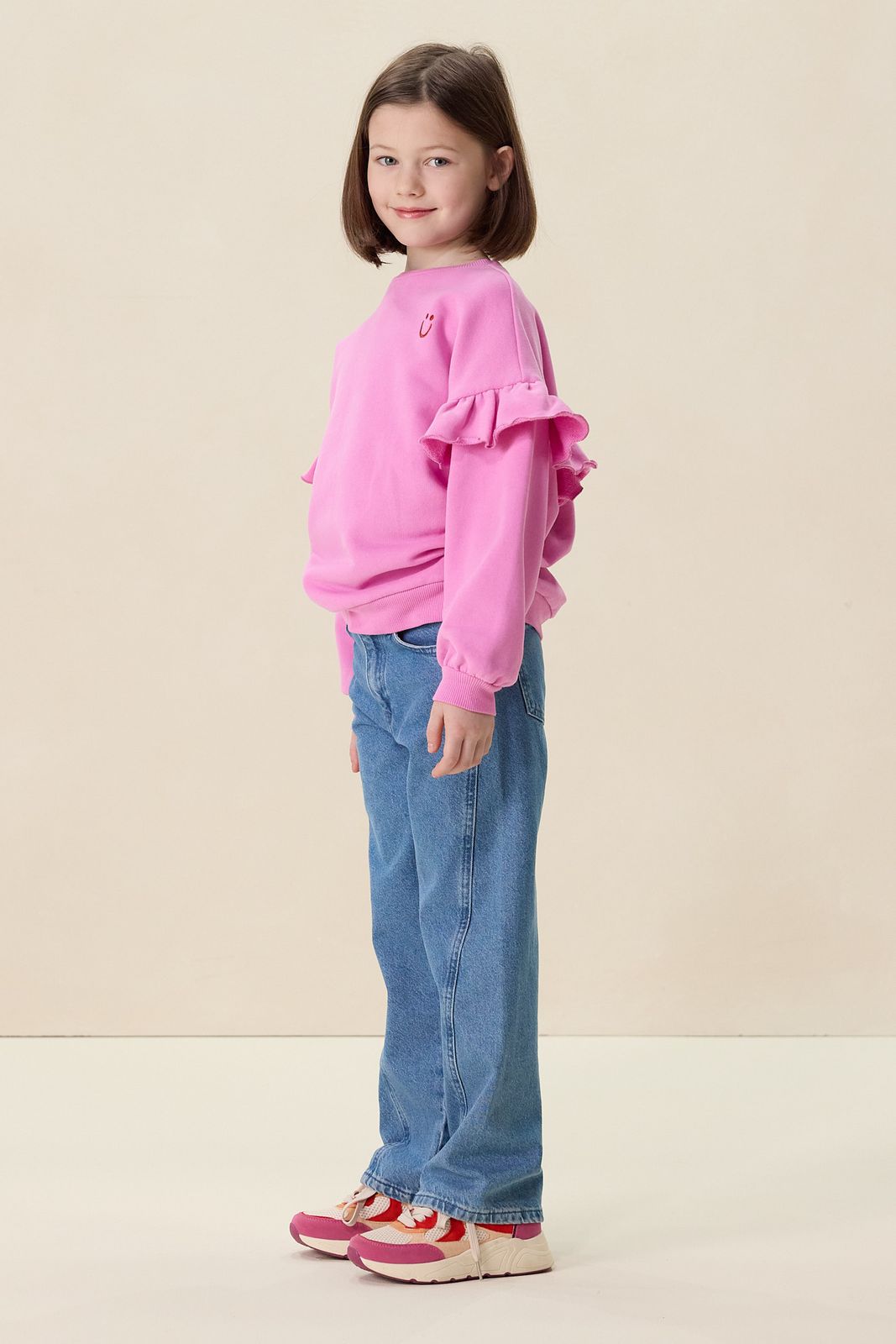 Roze oversized sweater met ruffles