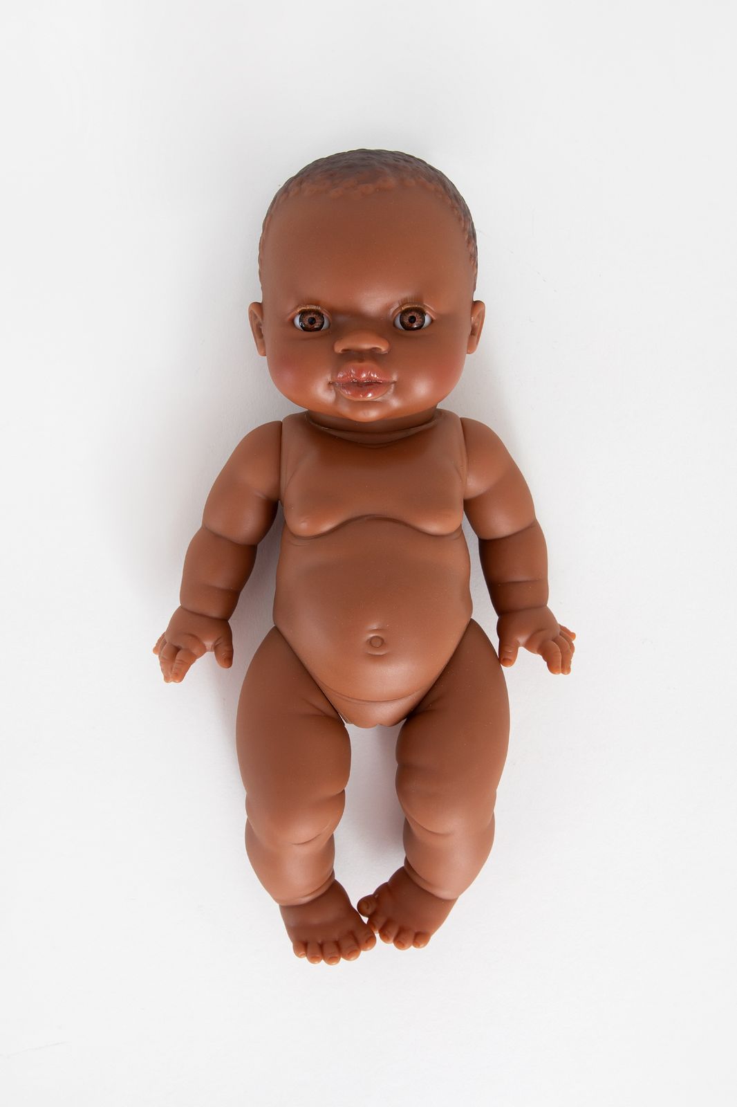 Pop met bruine ogen en zonder haar