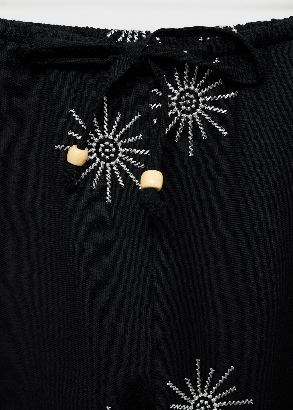 Long trousers with embroidered details - Black