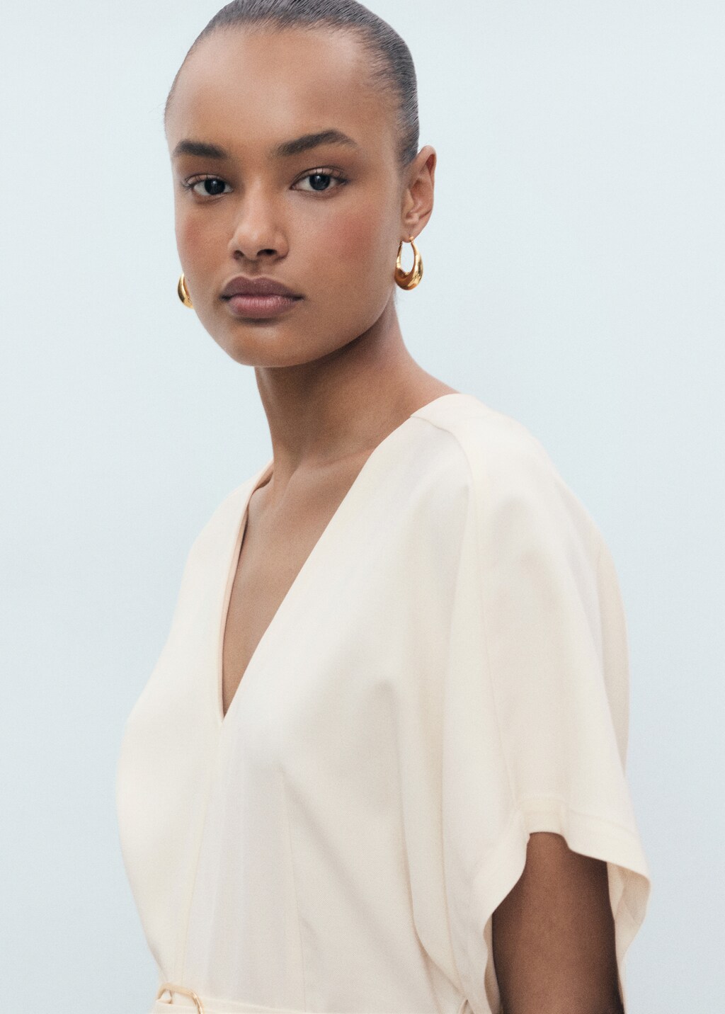 Long jumpsuit with belt and buckle - Ecru