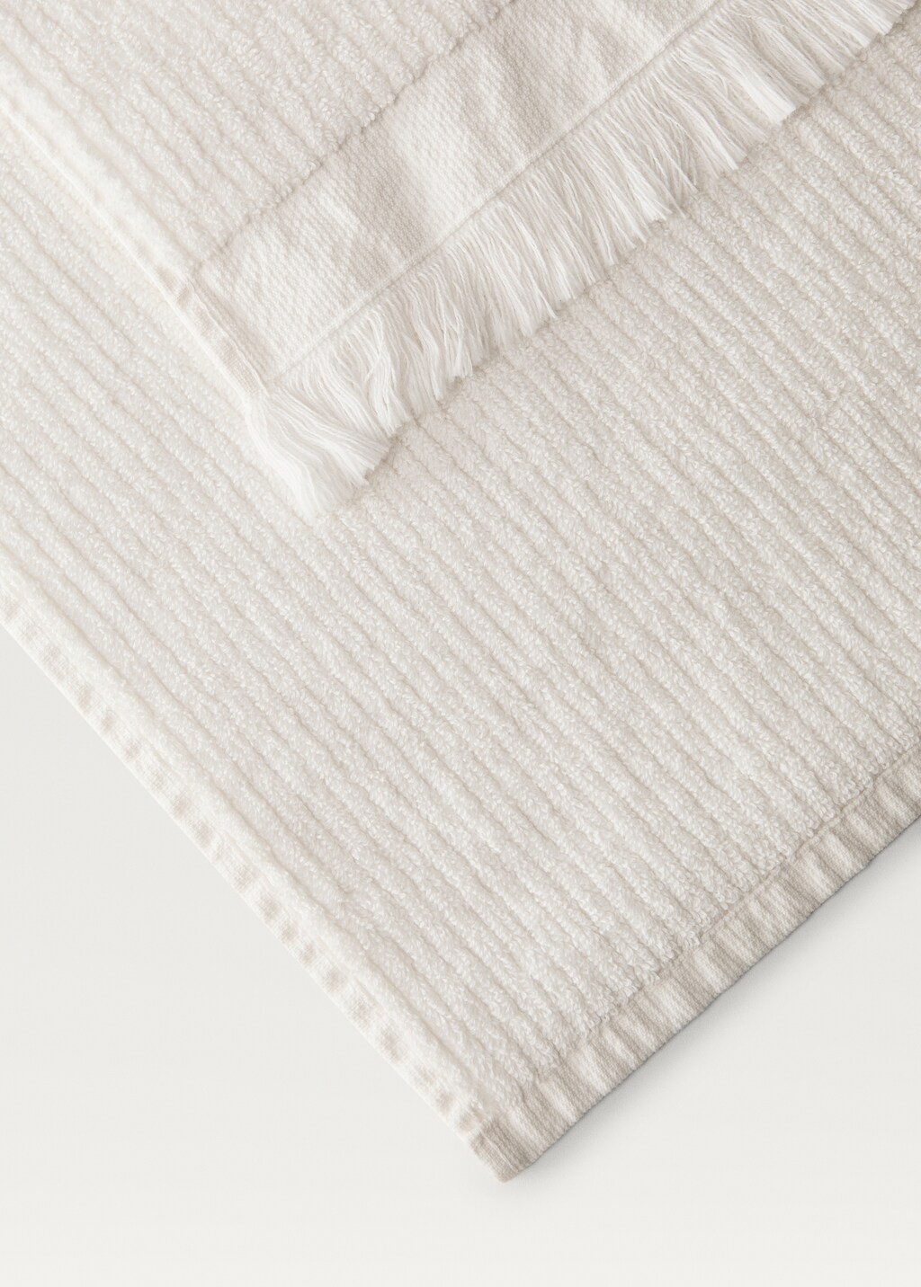Stripe-embossed hand towel with fringes - White