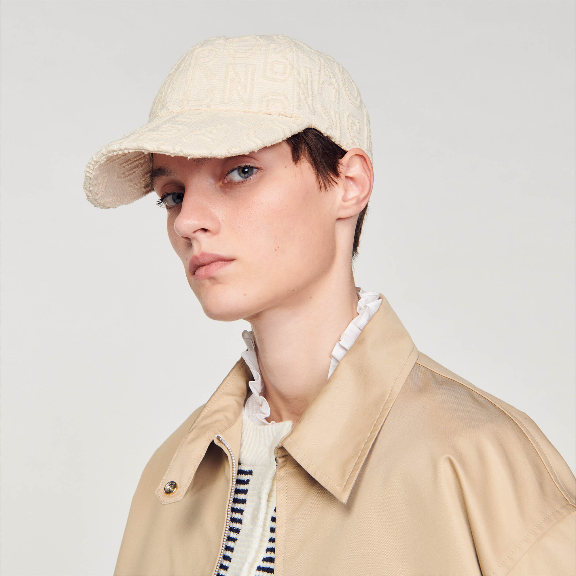 Cloth cap with embroidered letters