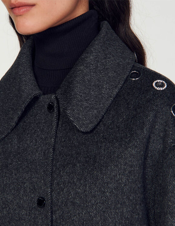 Oversized coat with eyelets