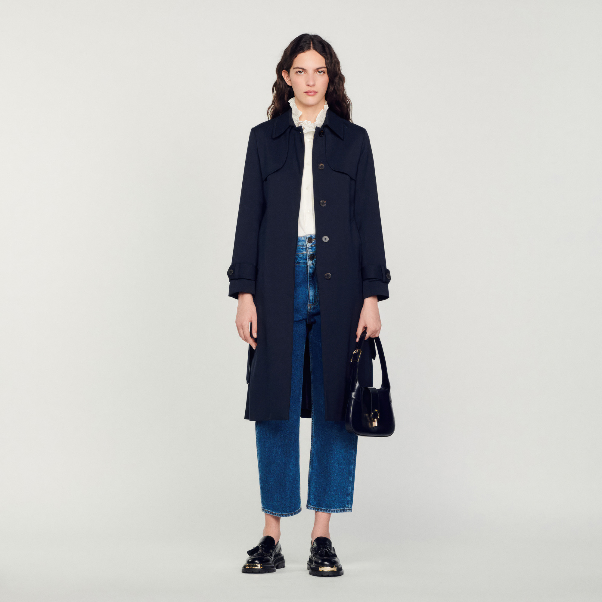 Trench coat with pleated inset