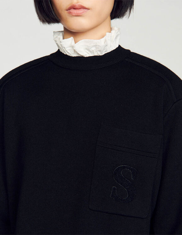 Knitted sweater with high neck