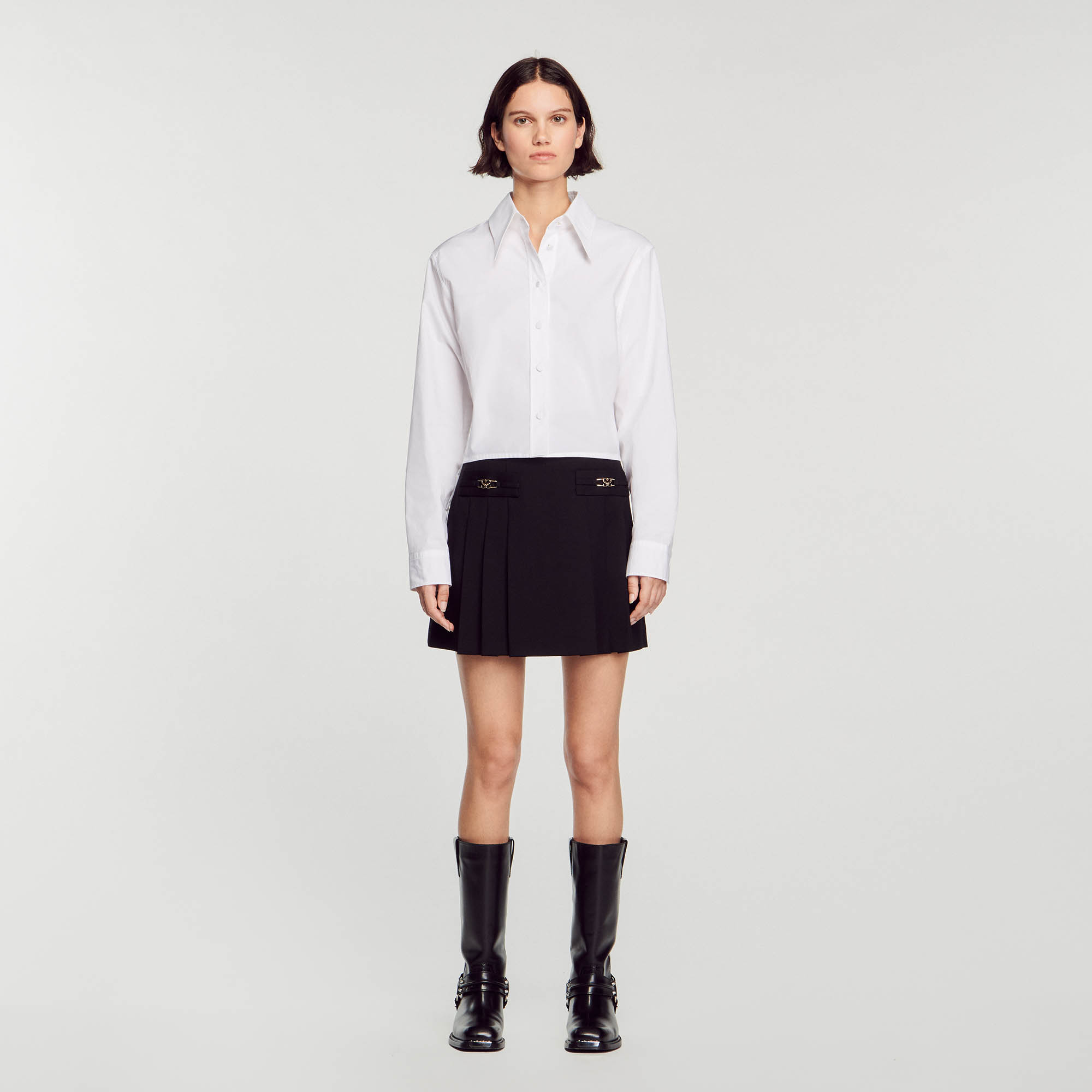 Short skirt with stitched pleats