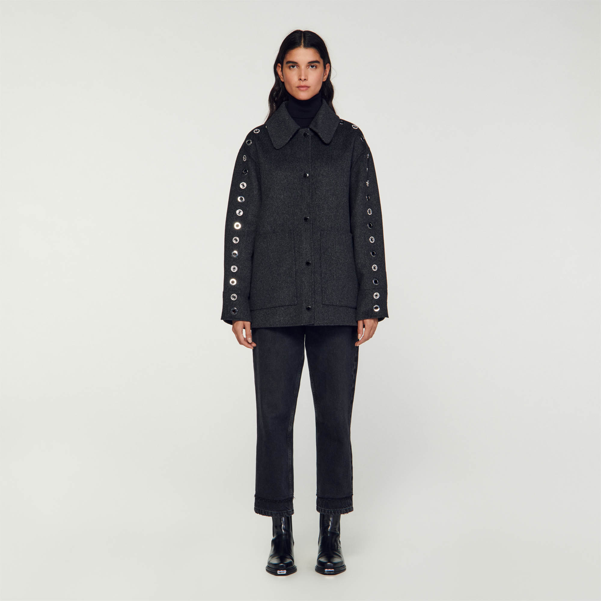 Oversized coat with eyelets