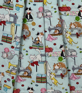 Cats on Sewing Machines on Blue Novelty Cotton Fabric