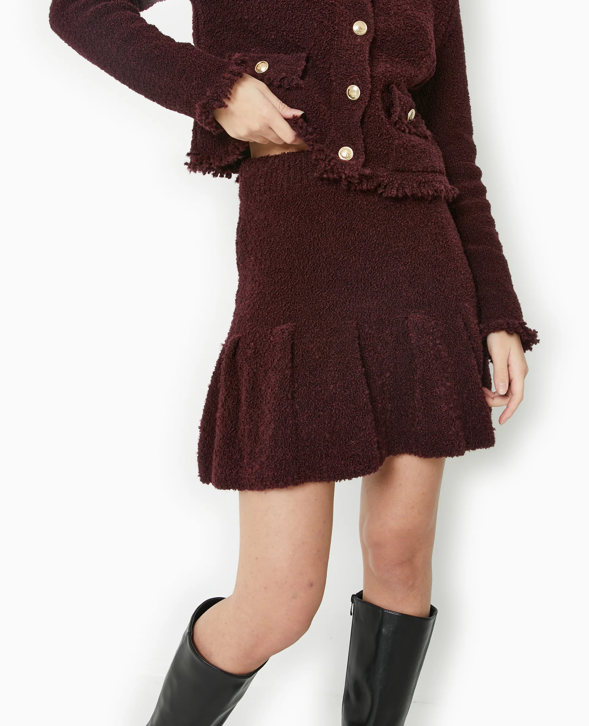 Jupe courte en maille bouclette avec volant