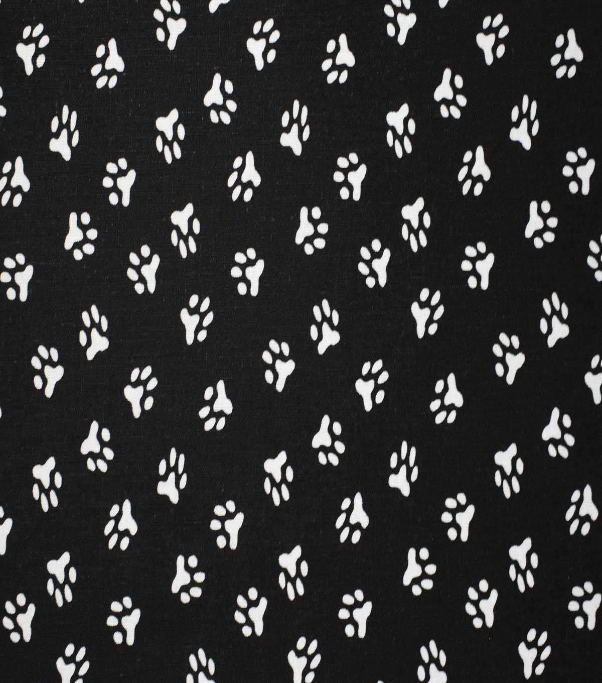 Paw Prints on Black Cotton Fabric by Quilter's Showcase