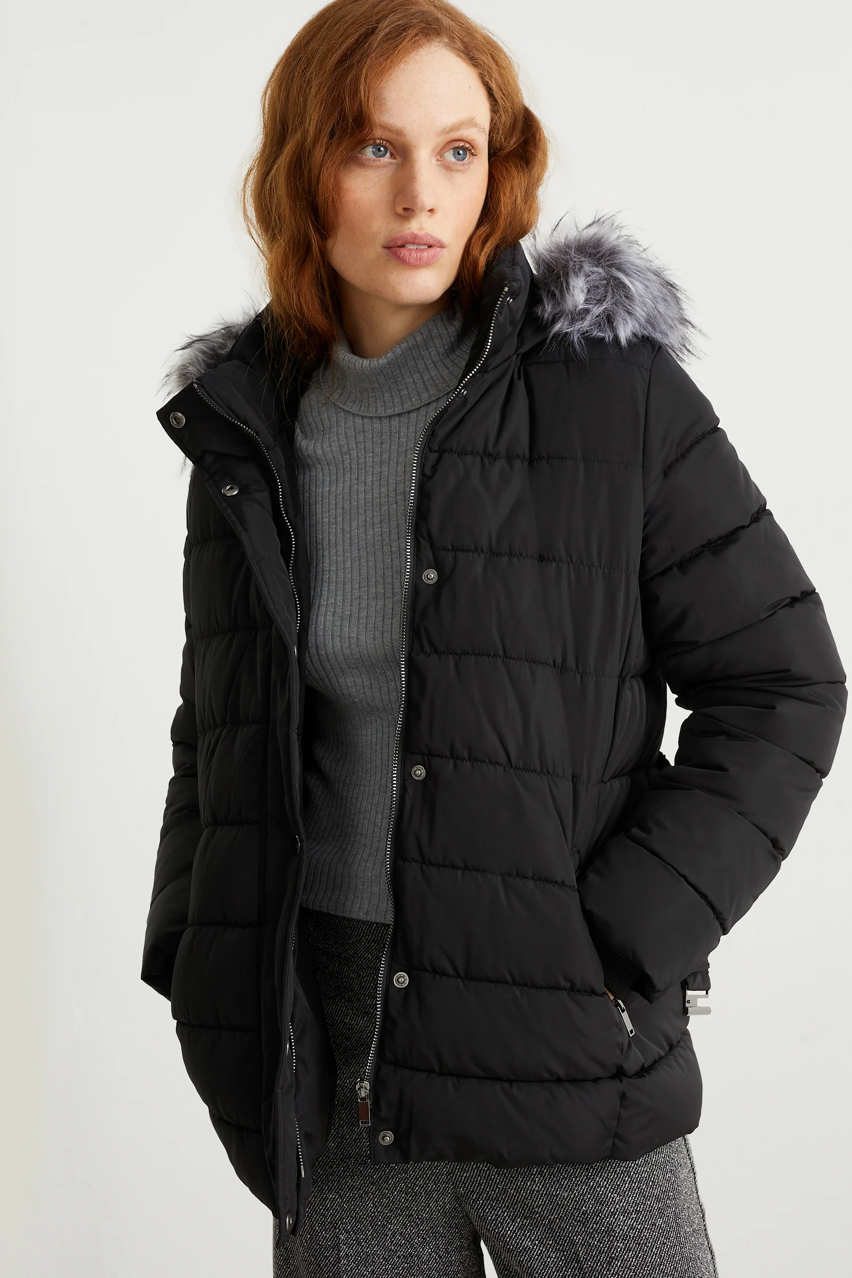Quilted jacket with hood and faux fur trim