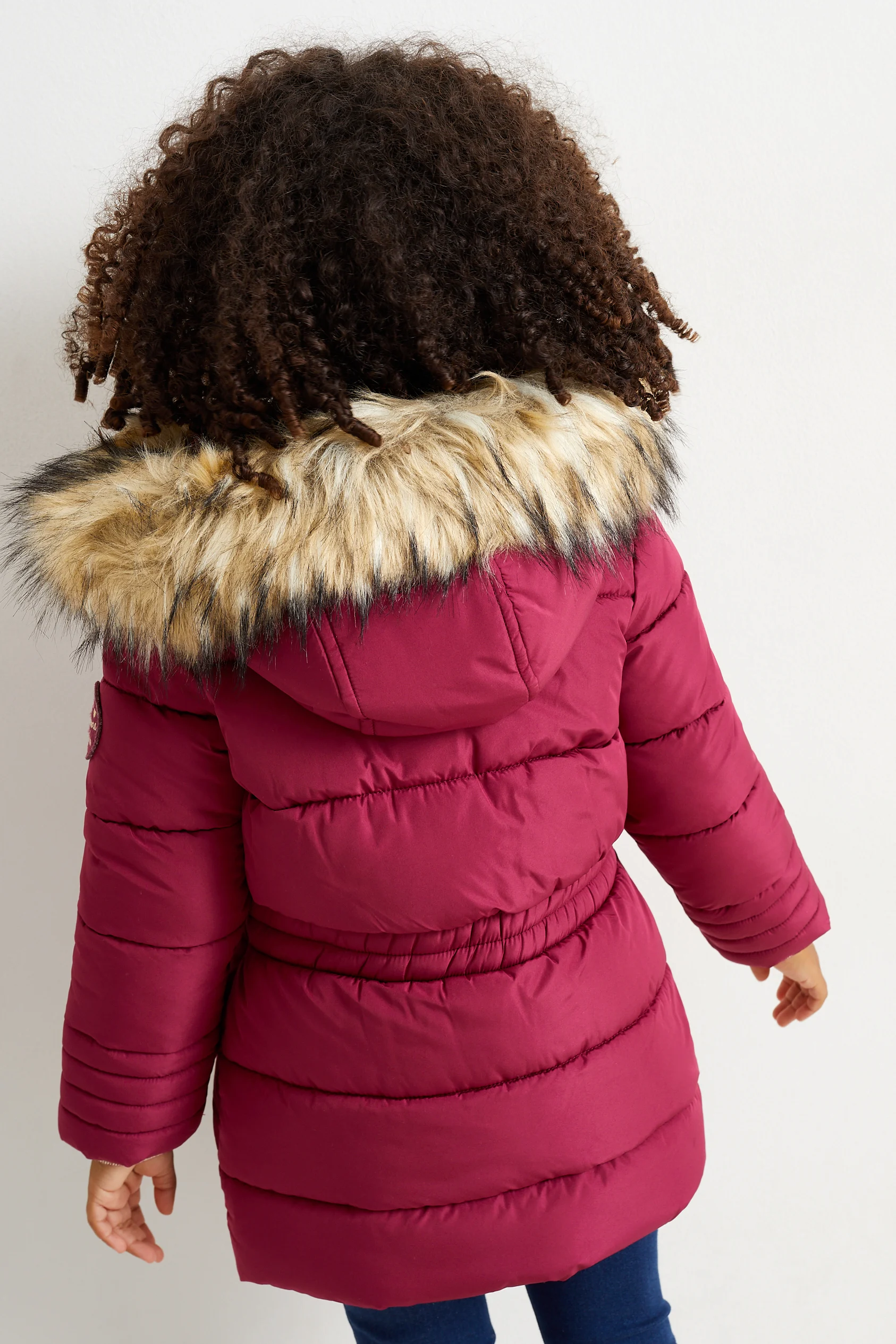 Quilted jacket with hood and faux fur trim