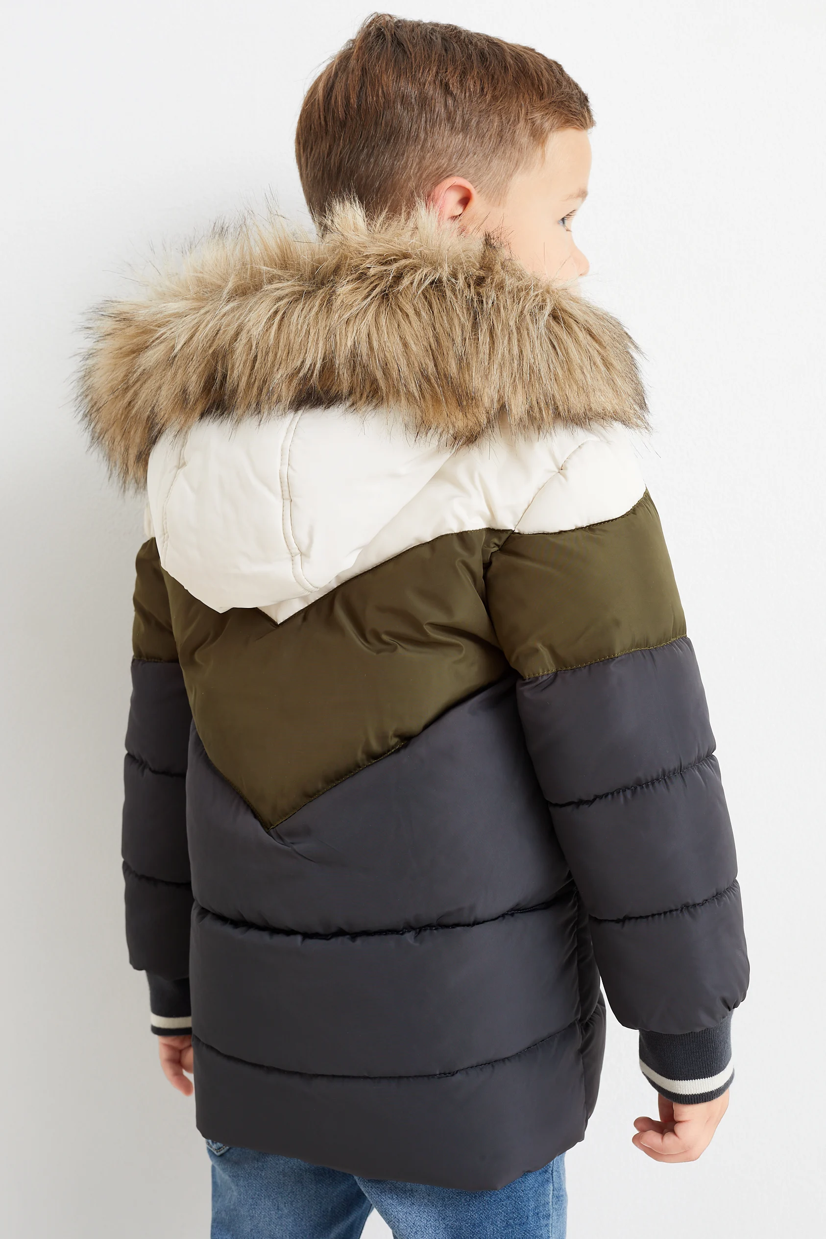 Quilted jacket with hood and faux fur trim