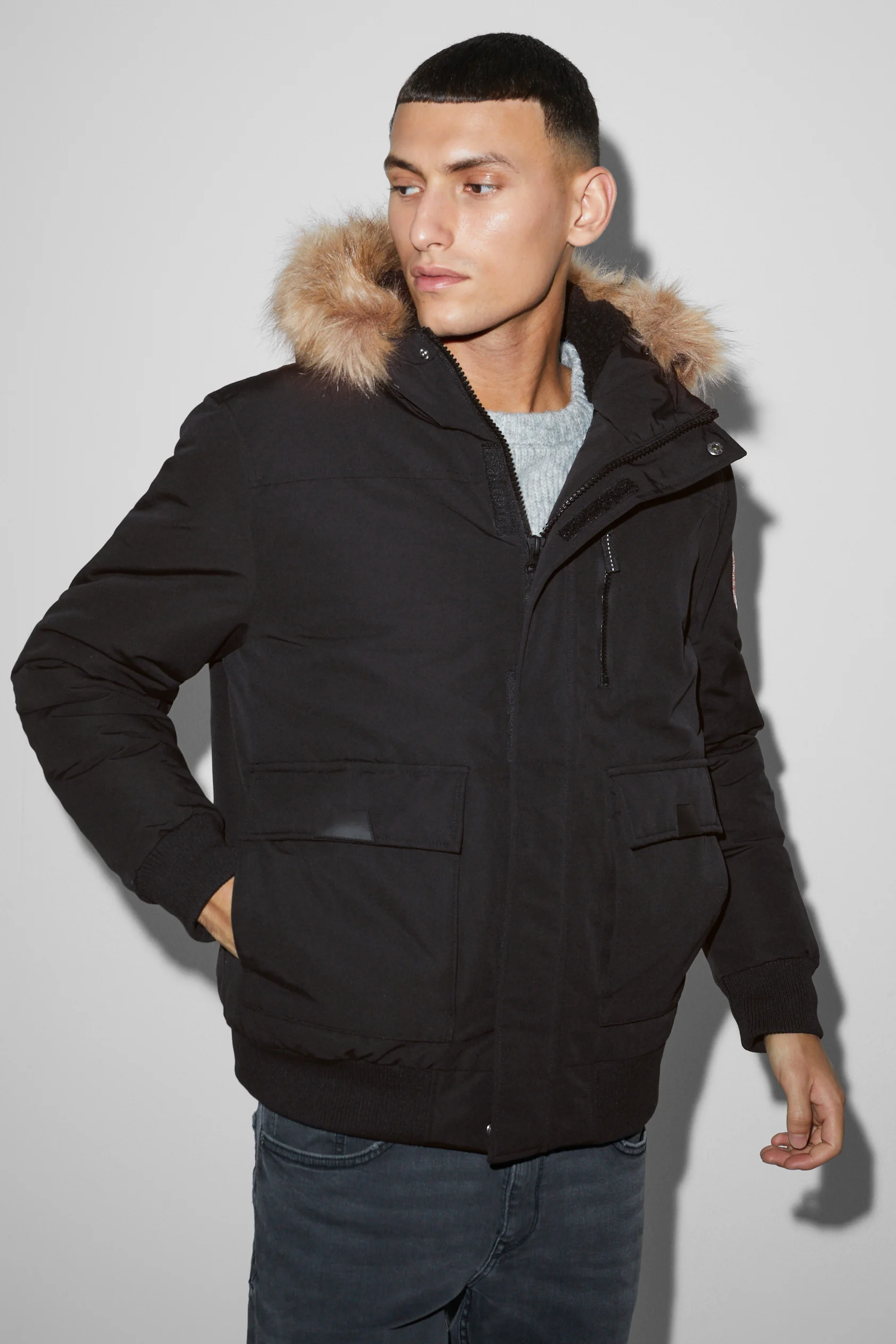 Jacket with hood and faux fur trim