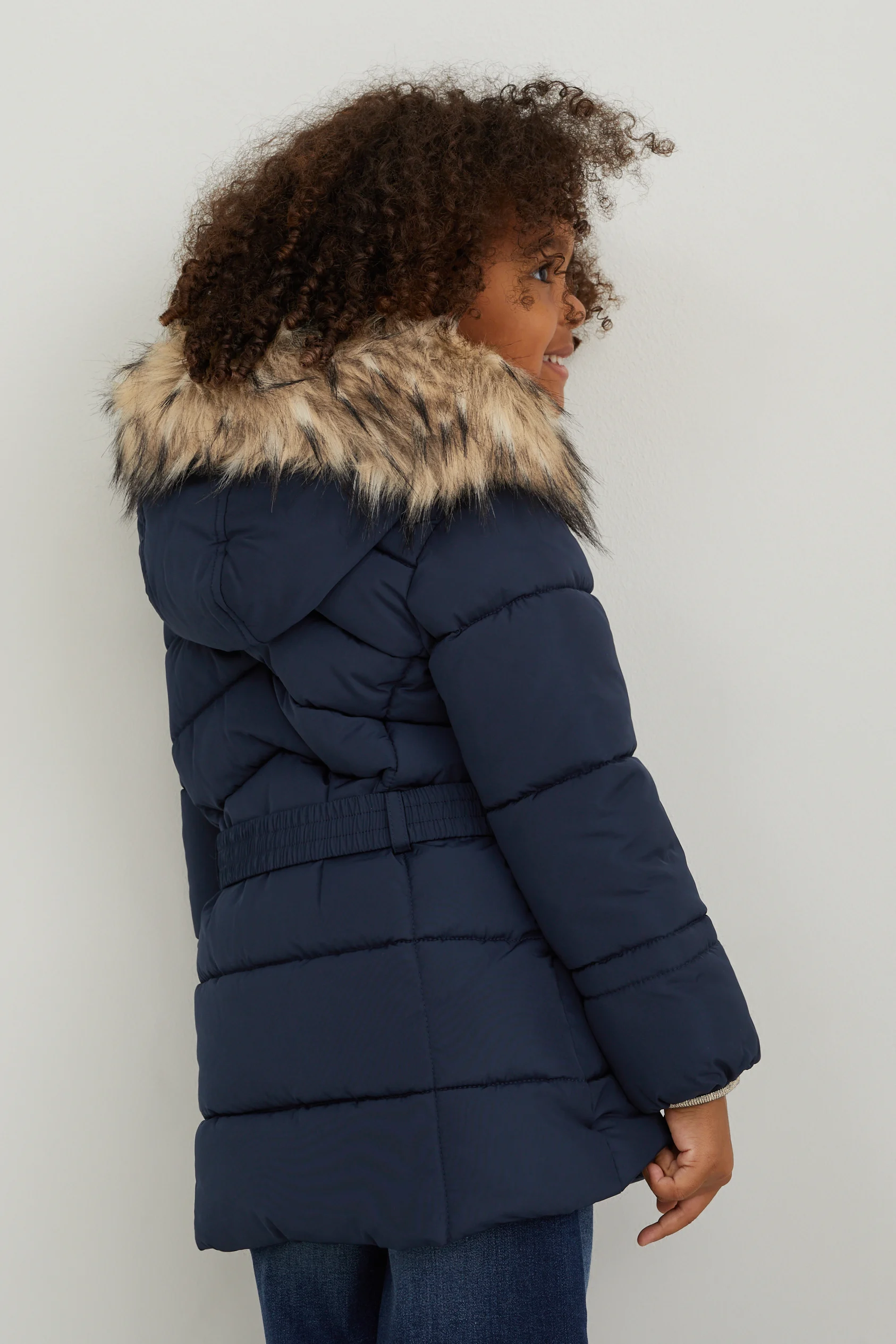 Quilted jacket with hood and faux fur trim