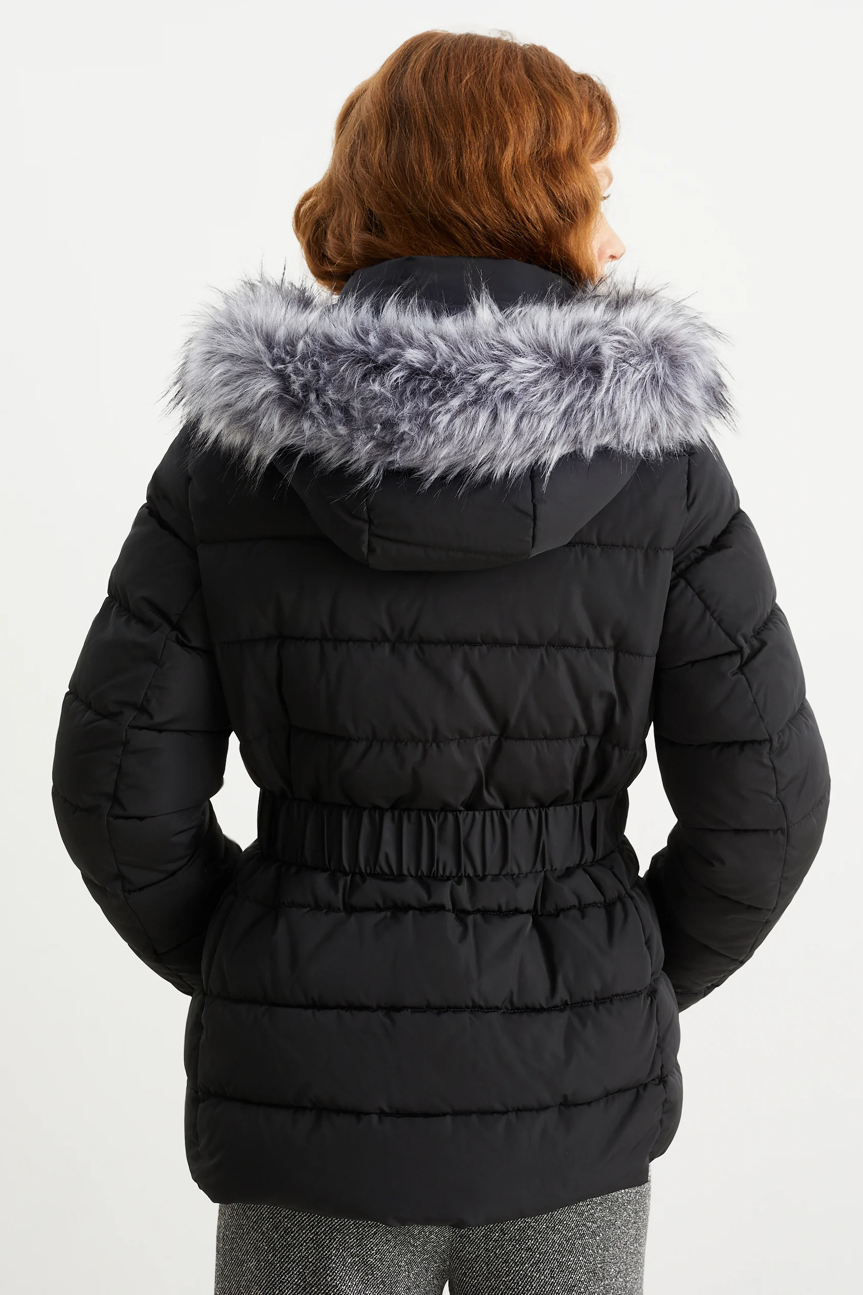 Quilted jacket with hood and faux fur trim