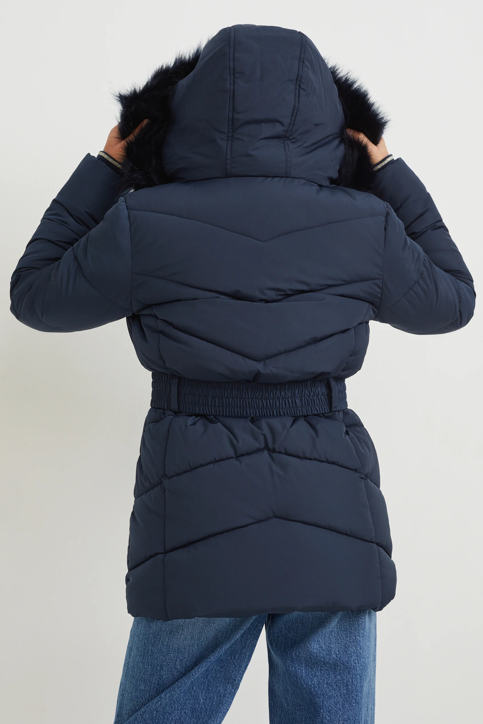 Quilted jacket with hood and faux fur trim