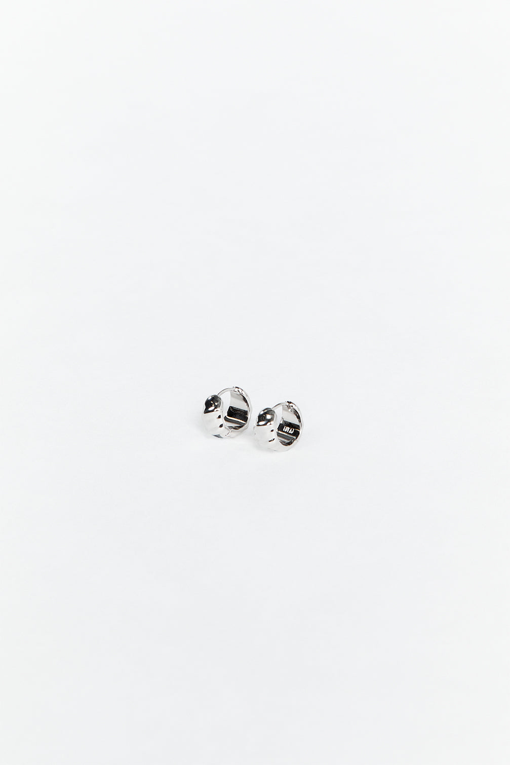 LUV AJ HAMMERED SILVER HUGGIE EARRINGS