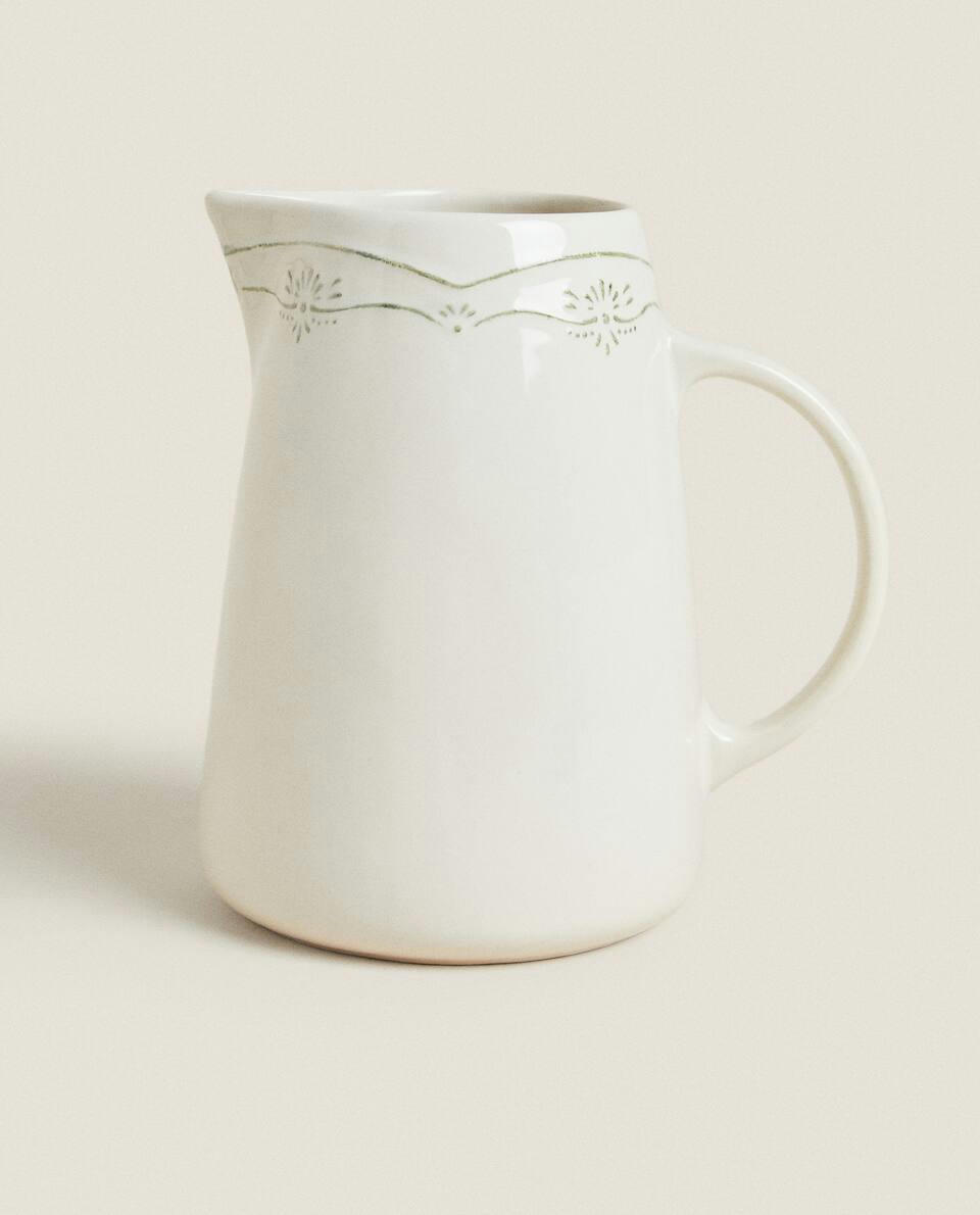 JUG WITH RAISED CHRISTMAS DESIGN