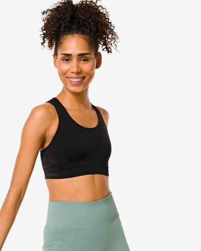 naadloze sporttop medium support zwart
